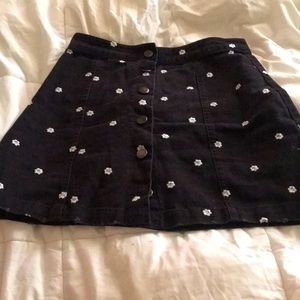 Black mini skirt with white daisies